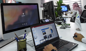 A Saudi employee using a laptop to prepare a slideshow at his office in the capital Riyadh. (AFP)