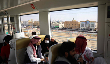 Passengers ride the metro in the Saudi capital Riyadh on December 1, 2024. (AFP)