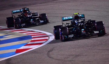 Mercedes’ Finnish driver Valtteri Bottas (front) leads Mercedes’ British driver George Russell during the qualifying session ahead of the Sakhir Formula One Grand Prix at the Bahrain International Circuit in the city of Sakhir on December 5, 2020. (AFP)