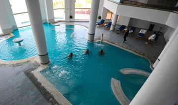 Guests bathe in a thermal pool at a spa in Korbous, in Tunisia's northeastern region of Nabul on January 25, 2025. (AFP)