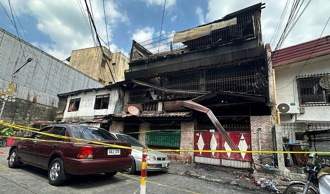 8 killed in Philippine fire that gutted a residential building in less than an hour