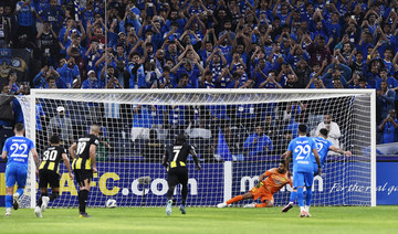 Al Hilal's Aleksandar Mitrovic scores their first goal from the penalty spot, March 5, 2024. (REUTERS)