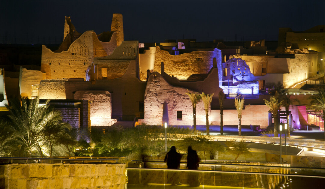 Visitors watch ancient palaces of the 18th century Diriyah fortified complex in Riyadh, Saudi Arabia. (AP)