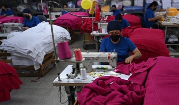 People work at a textile factory in Bogota, Colombia. (File/AFP)